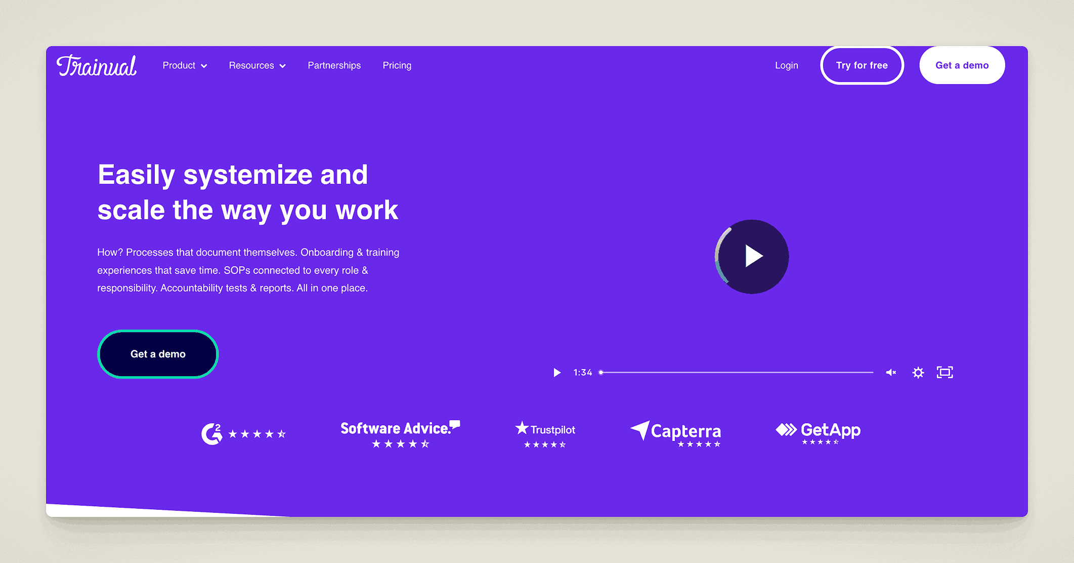 Trainual's website hero image showcases their platform for systemizing and scaling work, featuring a video demonstration and social proof from review sites like G2 and Trustpilot.